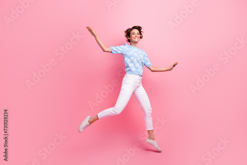 Full size portrait of cheerful gorgeous girl jumping flying have good mood isolated on pink color background