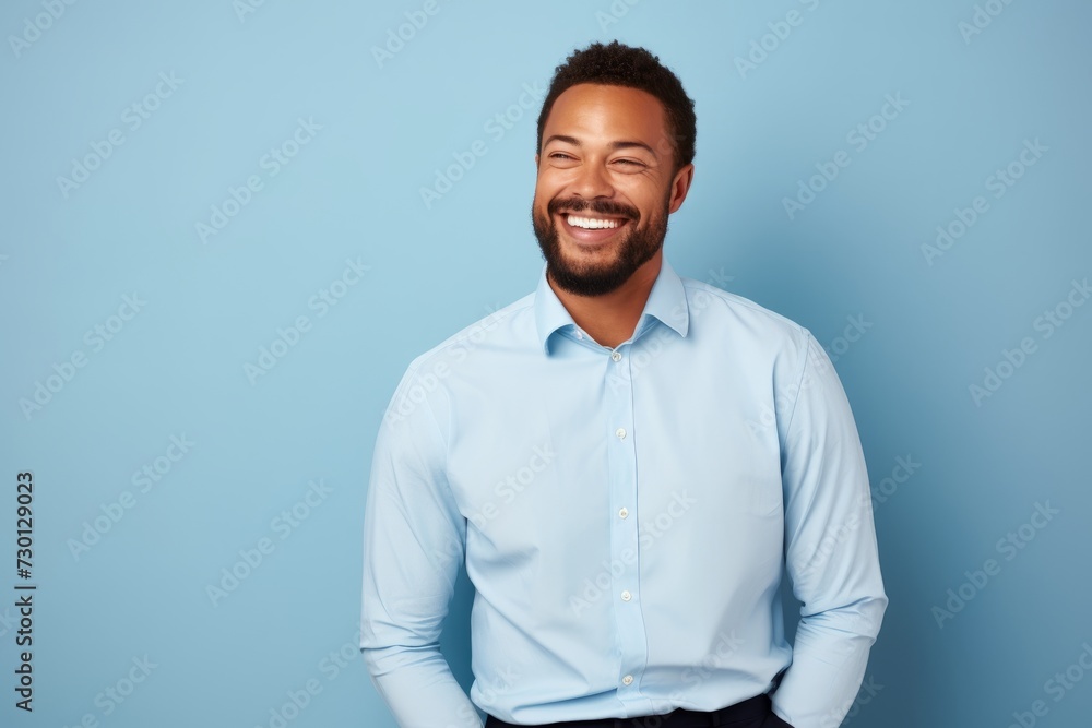Handsome african american man in shirt on blue background Handsome african american man in shirt on blue background