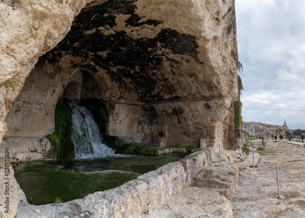 view of the Cave of Nymphaeum in the Neapolis Archaeological Park in downtwon Syracuse