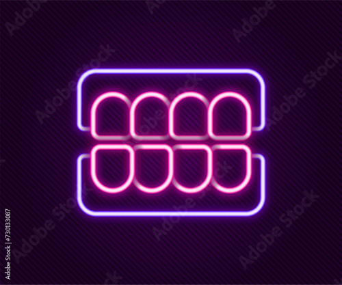 Glowing neon line False jaw icon isolated on black background. Dental jaw or dentures, false teeth with incisors. Colorful outline concept. Vector