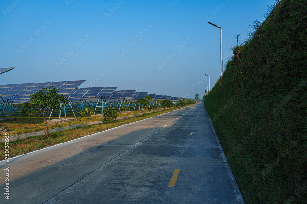 Solar Photovoltaic of solar farm view, solar plant rows array of on the water mount system Installation in earthen pond, water storage. Floating solar or floating photovoltaics (FPV)	
