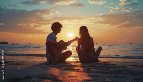 Young man is playing the guitar to his beautiful woman