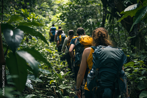a group of friends hiking through a lush rainforest. Equipped with backpacks and hiking gear - they share the experience of nature's wonders