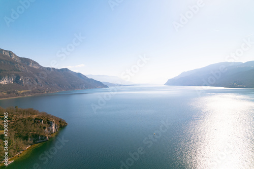 Kayak trip on the Lac du Bourget in Aix-Les-Bains, with aerial view by dorne of the canal from Savières to Chatillon, between castle, mountains and river in Savoie