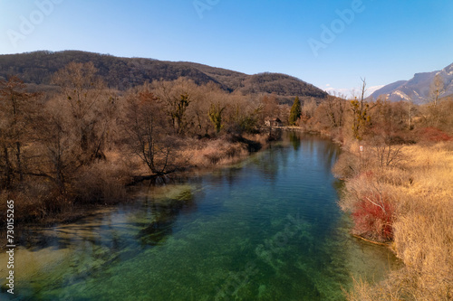 Kayak trip on the Lac du Bourget in Aix-Les-Bains, with aerial view by dorne of the canal from Savières to Chatillon, between castle, mountains and river in Savoie