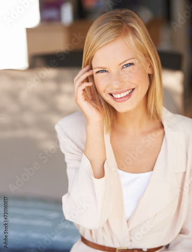 Smile, business woman and portrait of professional entrepreneur with confidence at workplace. Face, happy employee and young worker, blonde consultant or agent in office for career in Switzerland