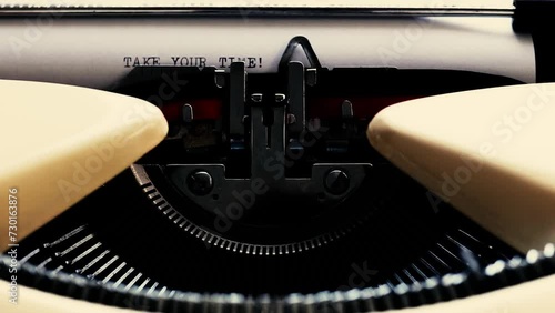 vintage typewriter type take your time sentence with ink, static shot photo
