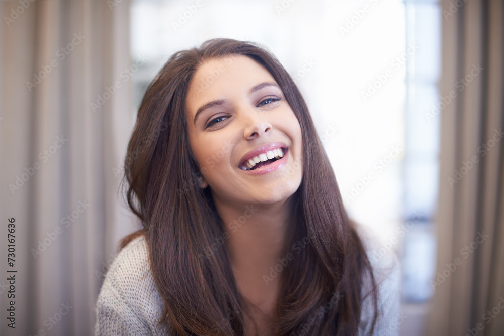 Woman, laugh and relax in home portrait with happiness on holiday or vacation with comfort in hotel. Travel, accommodation and girl with a smile in lounge at lodge with joke, humor or funny memory Woman, laugh and relax in home portrait with happiness on holiday or vacation with comfort in hotel. Travel, accommodation and girl with a smile in lounge at lodge with joke, humor or funny memory