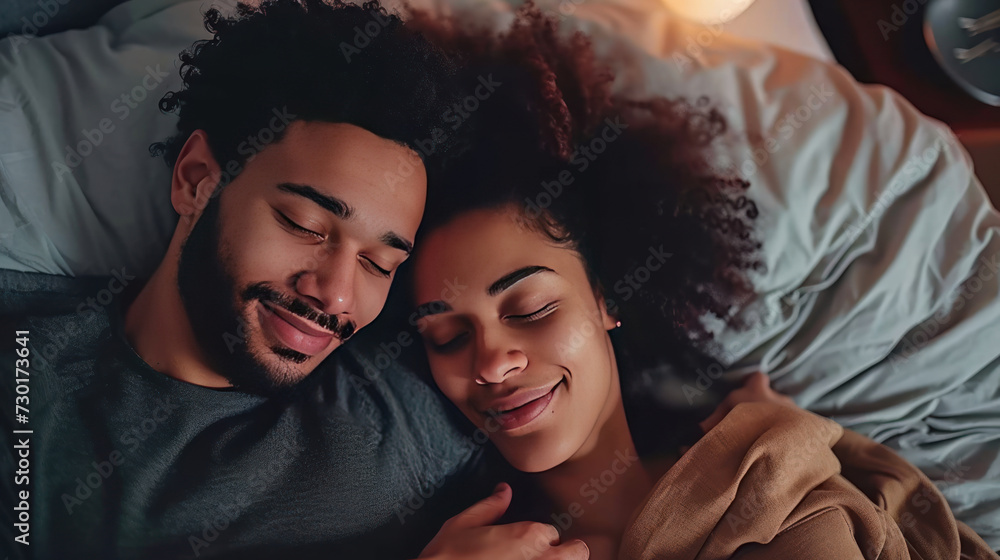Young multiethnic couple hugging lying bed at home cuddling. Young multiethnic couple hugging lying bed at home cuddling.