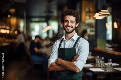 happy man waiter in restaurant, cafe or bar
