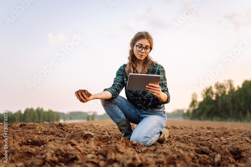 Woman farmer checking soil health before growth a seed of vegetable or plant seedling. Agriculture, gardening or ecology concept