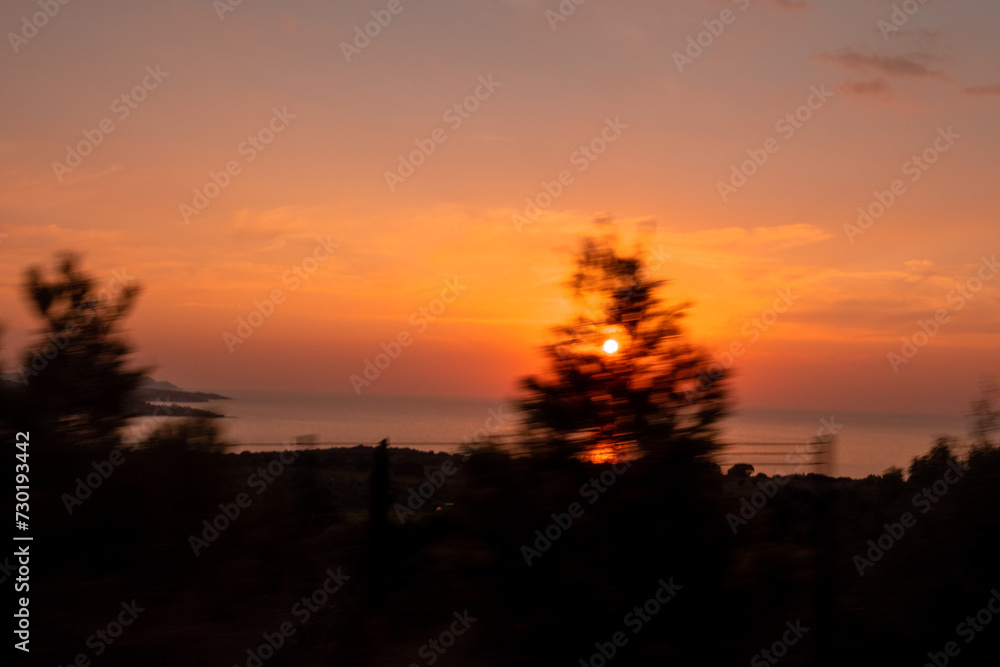 Long exposure photography of a sunset on a beach by the sea in Corsica