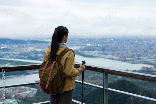 Woman go hiking and look at the Taipei city © leungchopan