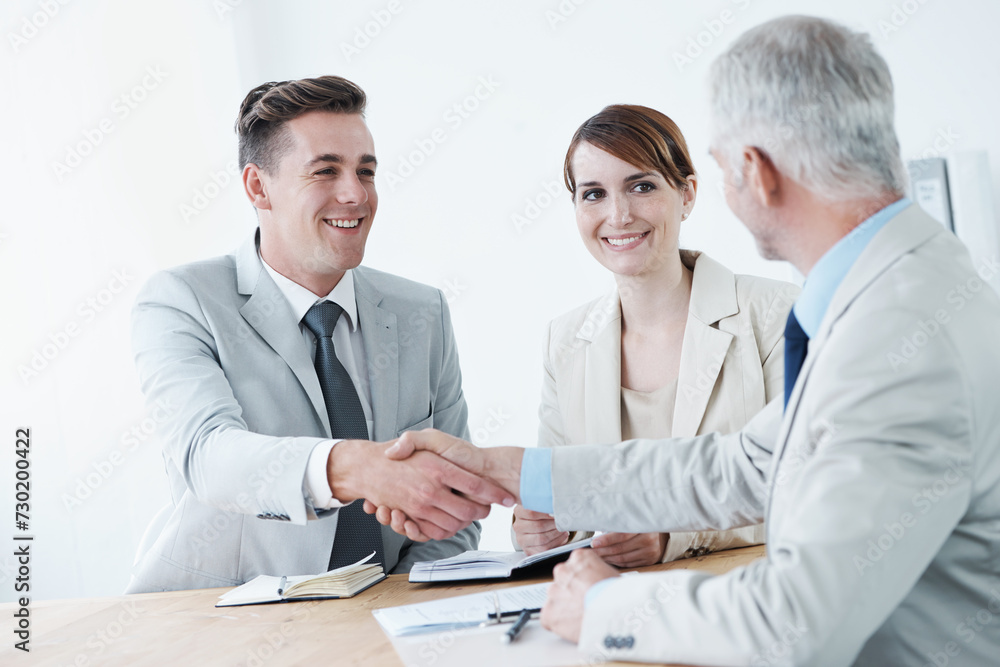 Shaking hands, happy business people or smile for partnership agreement or b2b deal in meeting. Handshake, start or excited corporate lawyers in collaboration for teamwork with contract or paperwork Shaking hands, happy business people or smile for partnership agreement or b2b deal in meeting. Handshake, start or excited corporate lawyers in collaboration for teamwork with contract or paperwork