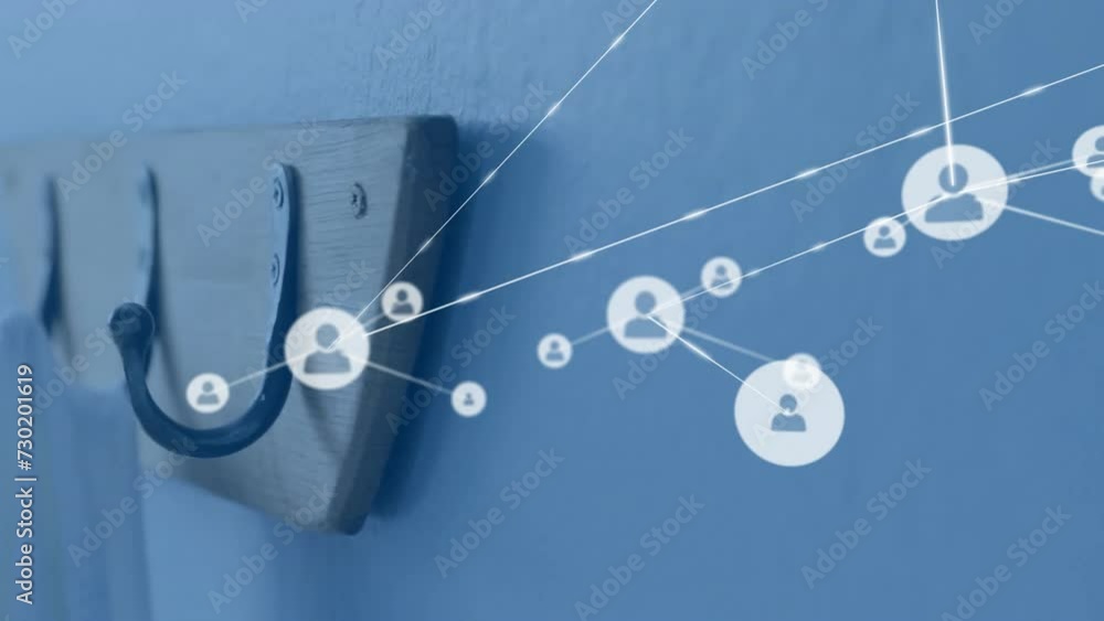 Animation of network of people icons over coat hooks on wall Animation of network of people icons over coat hooks on wall