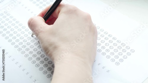 Close up student fill examination form. Education concept photo