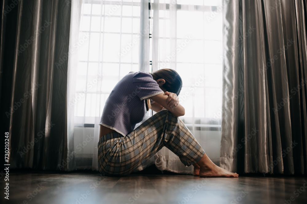 woman sit Depression Standing by window and anxiety Copy space. . woman sit Depression Standing by window and anxiety Copy space. .