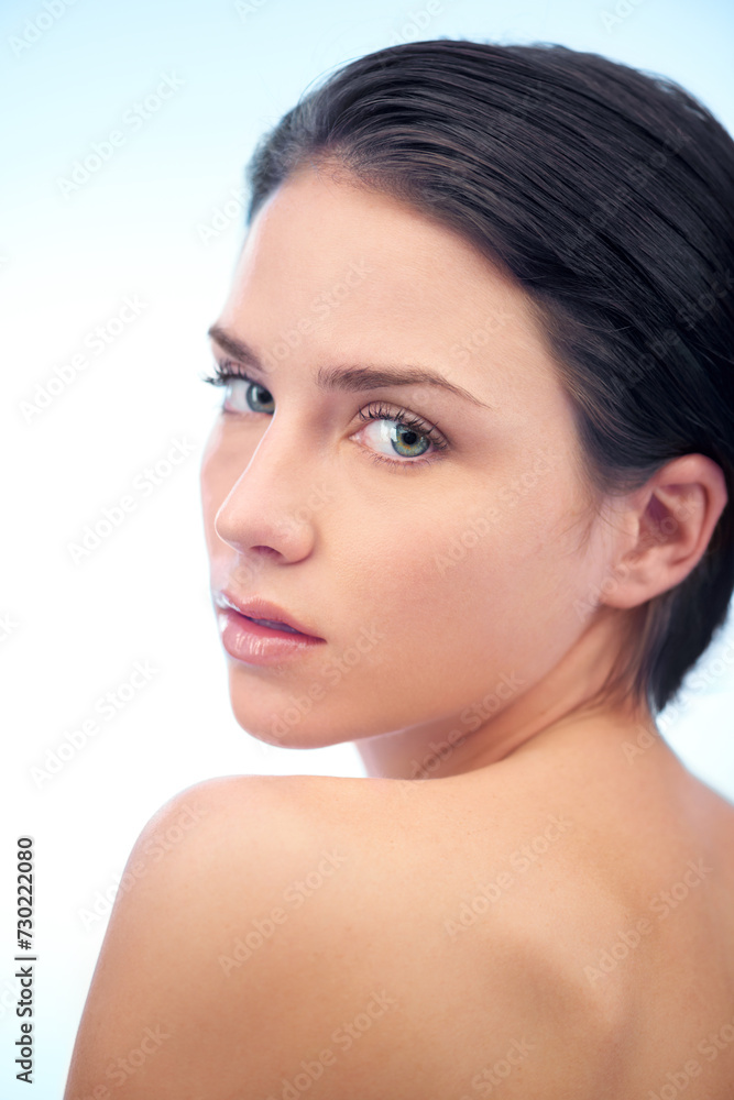 Health, skincare and portrait of woman in studio with beauty, cosmetic and face routine. Wellness, glow and confident young female person with facial salon dermatology treatment by blue background. Health, skincare and portrait of woman in studio with beauty, cosmetic and face routine. Wellness, glow and confident young female person with facial salon dermatology treatment by blue background.