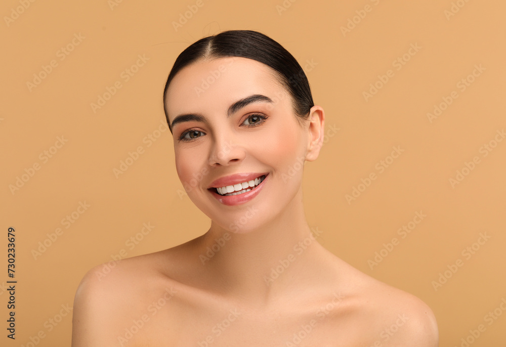 Beautiful woman with healthy skin on beige background Beautiful woman with healthy skin on beige background