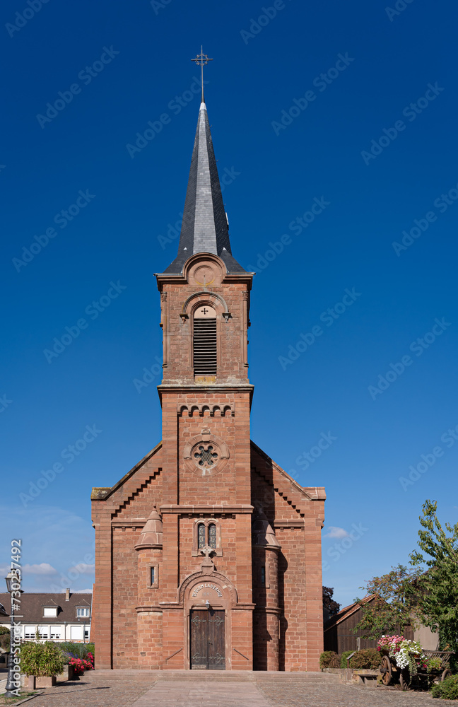 Mittelbergheim, France - 09 10 2020: Alsatian Vineyard. View of a typical Alsatian church  .