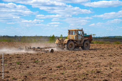 Soviet old tractor buries a field