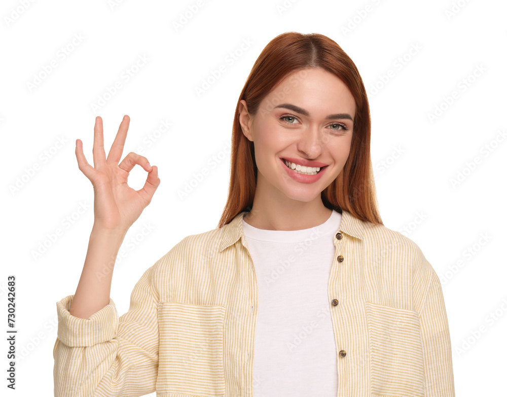 Beautiful woman with clean teeth showing ok gesture on white background Beautiful woman with clean teeth showing ok gesture on white background