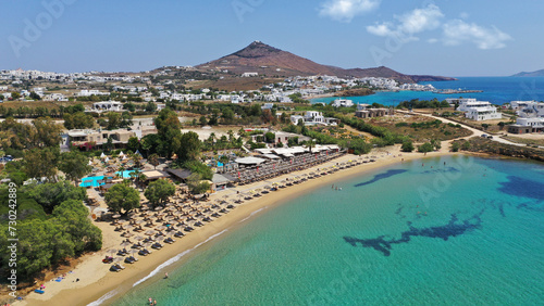 Aerial drone photo from sandy organised with umbrellas and sun beds beach of Pounta with crystal clear emerald sea, Paros island, Cyclades, Greece © aerial-drone