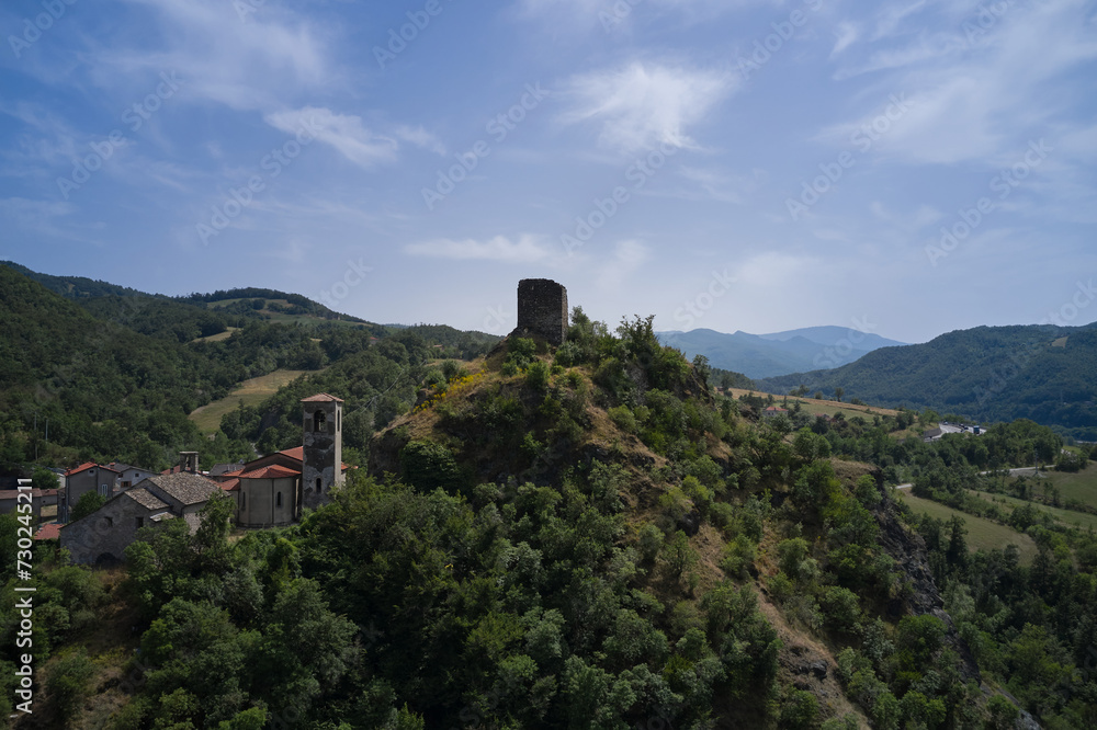 Italy's architectural splendor: A drone's-eye view of Castello di Pietramogolana and Viadotto Rio Pietramogolana in Pietramogolana PR. A picturesque panorama.