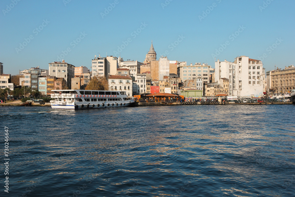 
Istanbul cityscape with Galata tower behind buildings. View from Bosphorus, Turkey