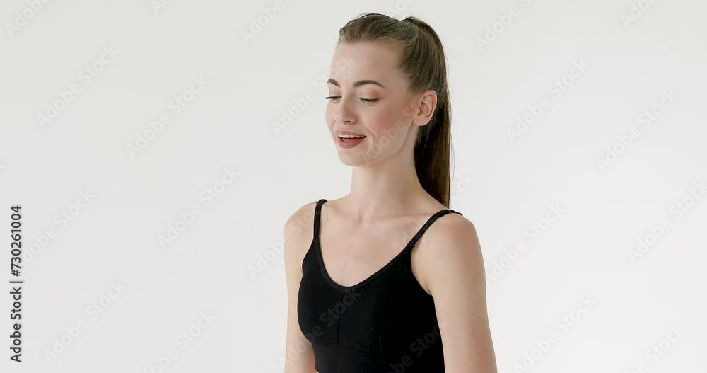 Young beautiful girl posing and laughing at the camera on a white background Young beautiful girl posing and laughing at the camera on a white background