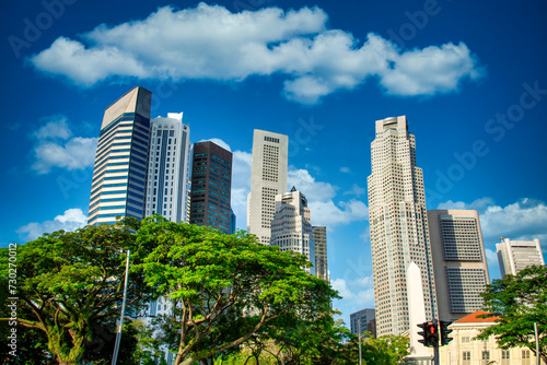 Singapore city skyline of business district downtown on blue sky with cloud in daytime. © nuttawutnuy
