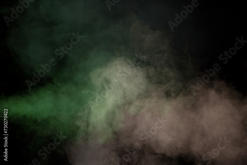 Green and white steam on a black background.