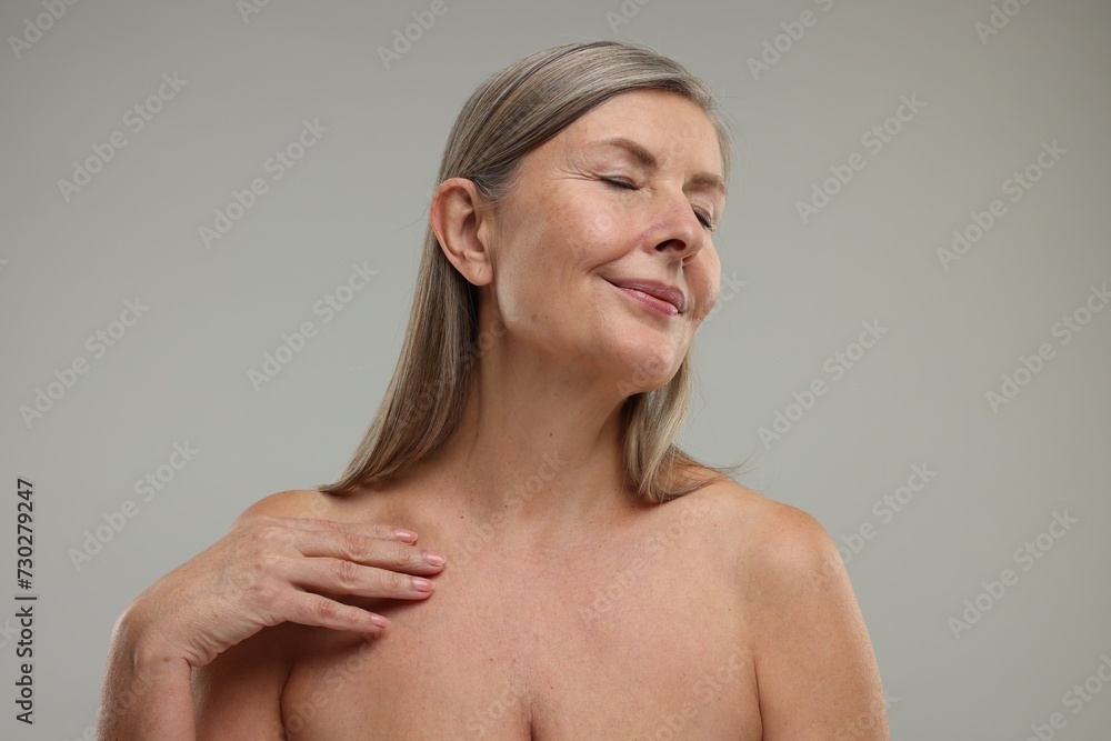 Beautiful woman with healthy skin on grey background Beautiful woman with healthy skin on grey background