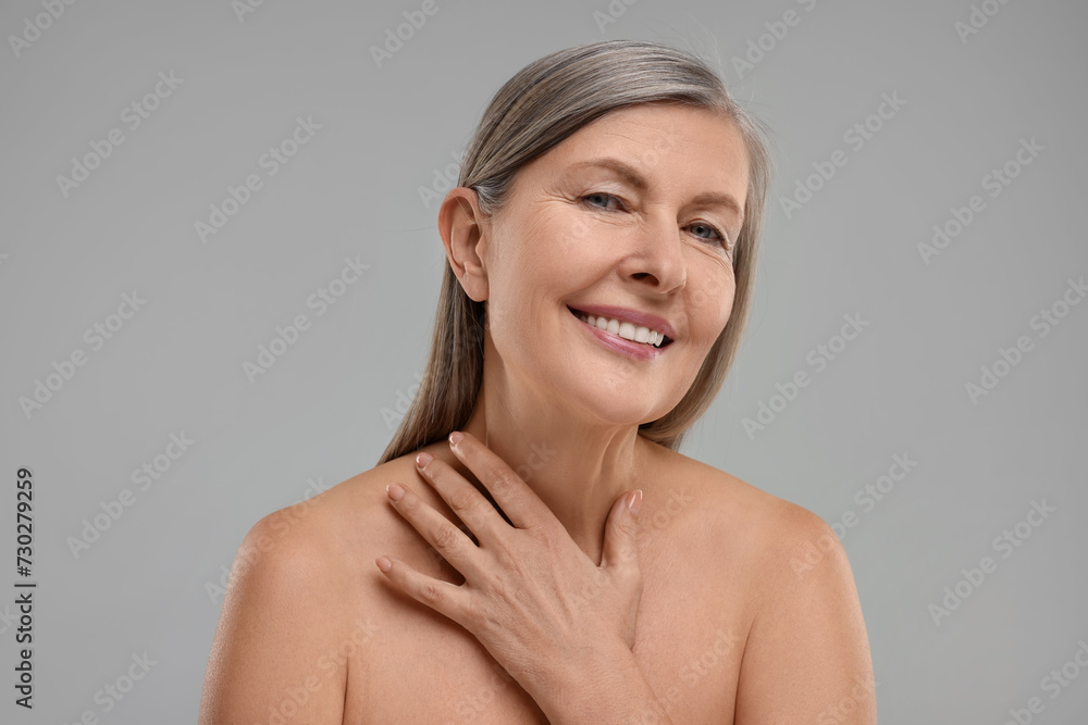 Beautiful woman with healthy skin on grey background Beautiful woman with healthy skin on grey background
