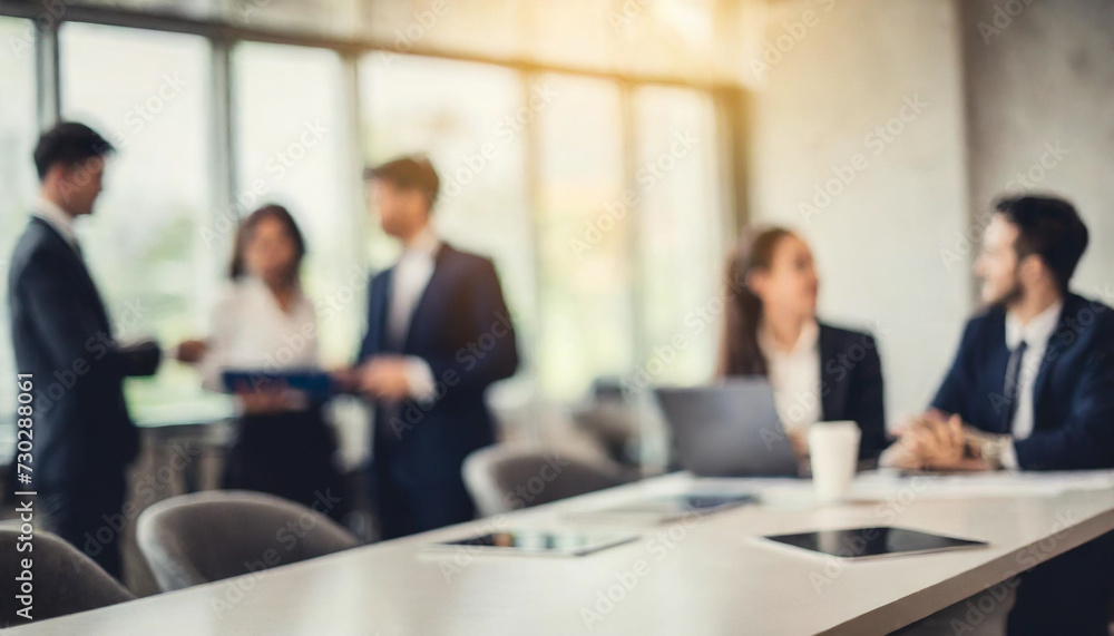 Blurry office meeting scene symbolizing business dynamics, with copy space