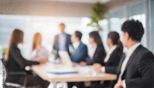 Blurry office meeting scene symbolizing business dynamics, with copy space