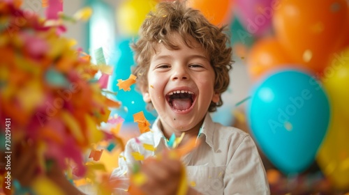 A birthday boy gleefully smashing