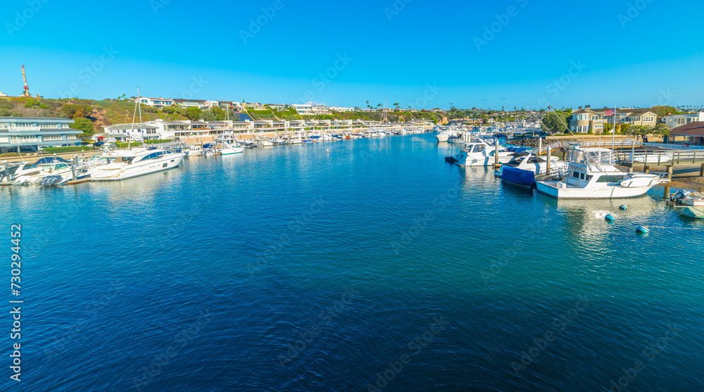 Boats in Newport Beach under a blue sky