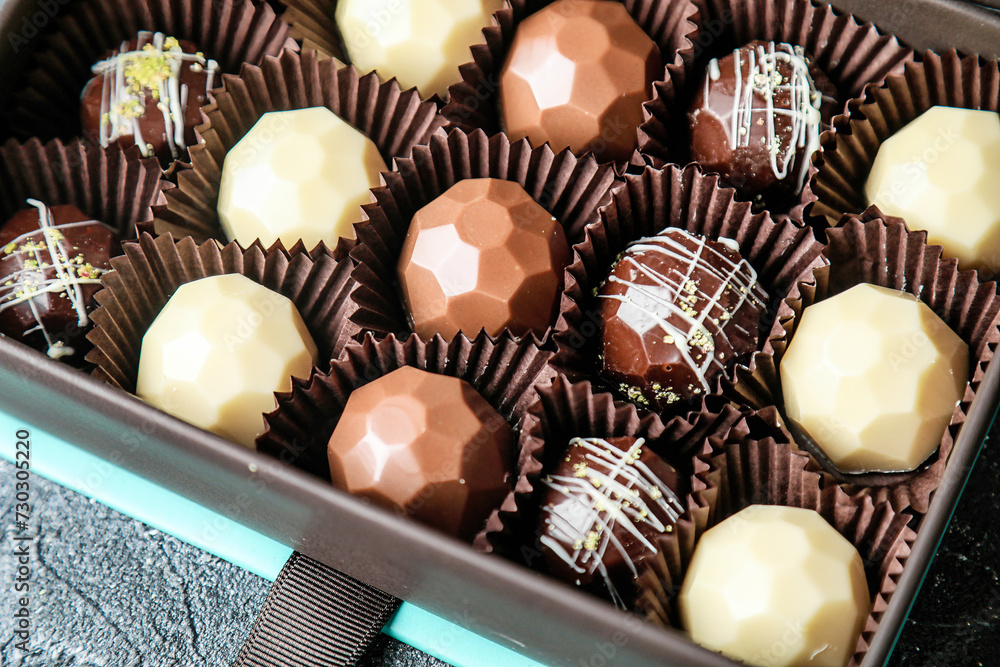 Assorted Chocolates Filling a Box on a Table Assorted Chocolates Filling a Box on a Table