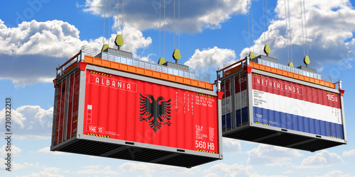 Shipping containers with flags of Albania and Netherlands - 3D illustration