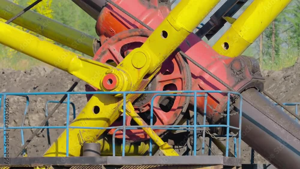Wheel Mechanism Of Heavy Industrial Excavator Machine Rotated By Steel Wires. Wheel Component Provides Mechanical Power To Boom Of Heavy Excavator Machine. Heavy Excavator Machine At Gold Mine Wheel Mechanism Of Heavy Industrial Excavator Machine Rotated By Steel Wires. Wheel Component Provides Mechanical Power To Boom Of Heavy Excavator Machine. Heavy Excavator Machine At Gold Mine