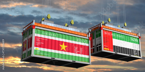 Shipping containers with flags of Suriname and United Arab Emirates - 3D illustration photo