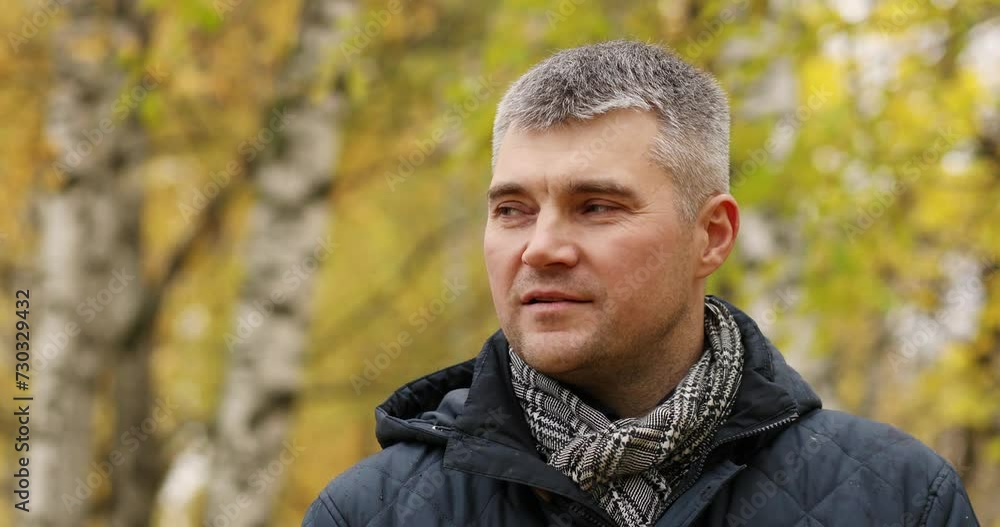 Close-up of handsome man looking around in an autumn forest, shallow dof Close-up of handsome man looking around in an autumn forest, shallow dof