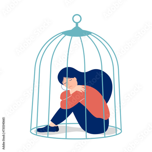 Sad girl sitting in a cage isolated on white background. Depression and self-isolation concept. Mental health. Depression concept