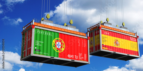 Shipping containers with flags of Portugal and Spain - 3D illustration