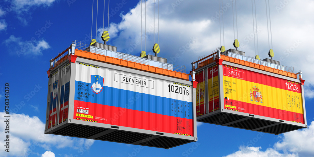 Shipping containers with flags of Slovenia and Spain - 3D illustration