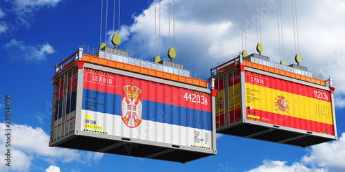 Shipping containers with flags of Serbia and Spain - 3D illustration