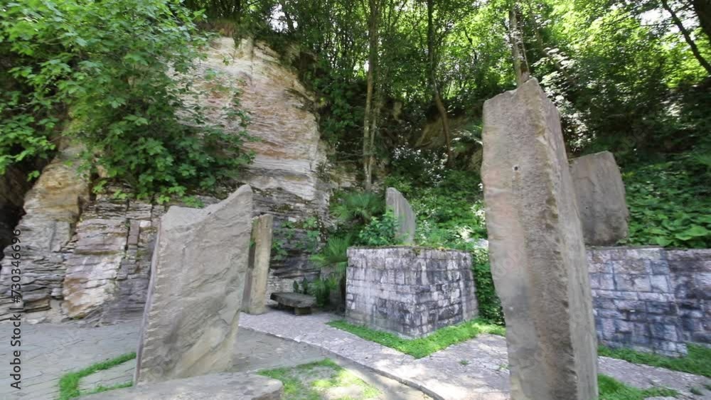 Big stones in beautiful green garden at sunny summer day Big stones in beautiful green garden at sunny summer day
