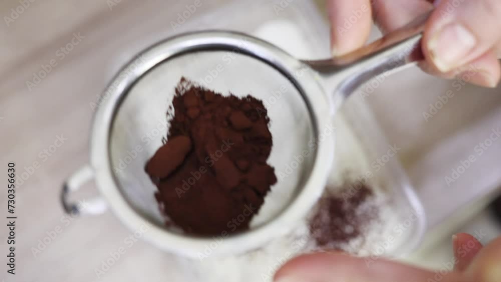 Hands sprinkle cake with cocoa, top, close up, slow motion Stock Video ...