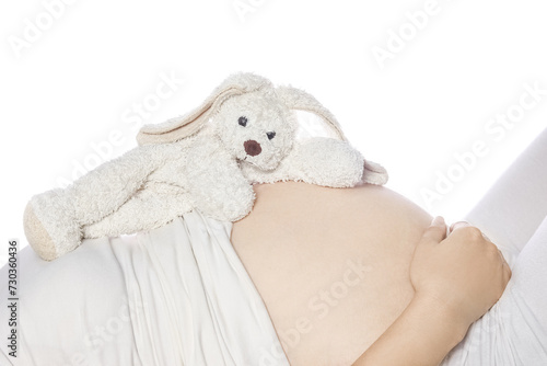 Happy pregnant girl lies on white background